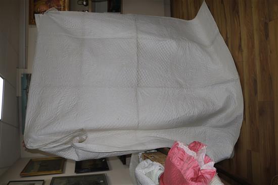 An off-white quilt with blue stitching, a reversible blue and cream quilt, a creamy oyster quilt and a mint green quilt (4)